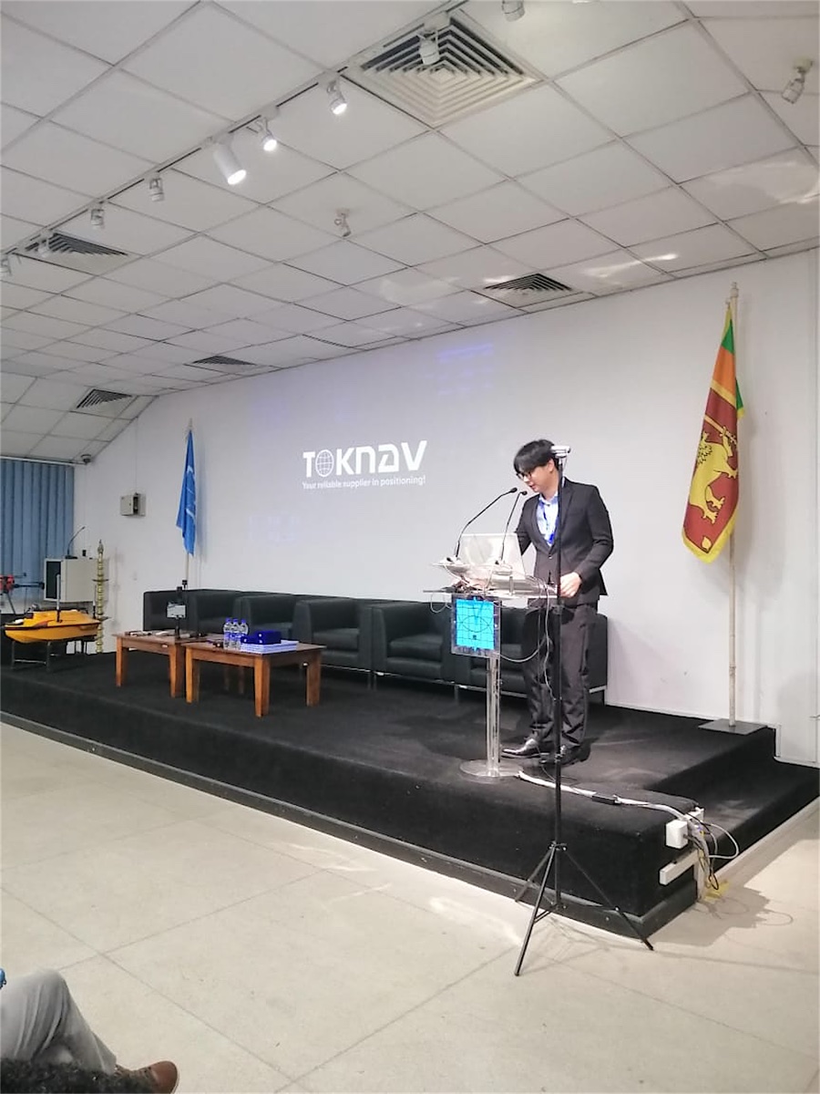 TOKNAV speaker delivers a technical geospatial presentation in Sri Lanka