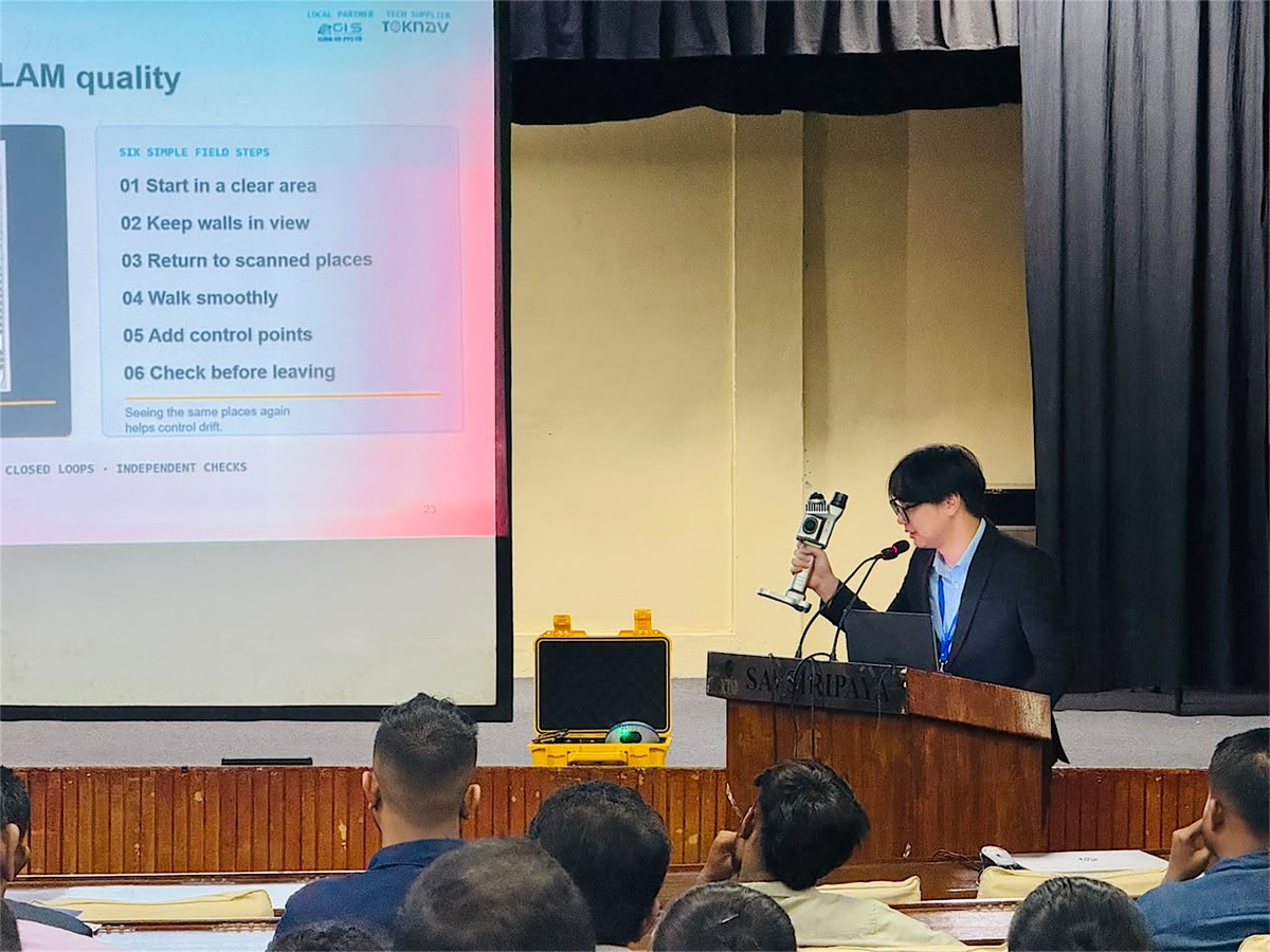 A TOKNAV presenter explains GNSS RTK quality assurance to a Sri Lankan surveying audience
